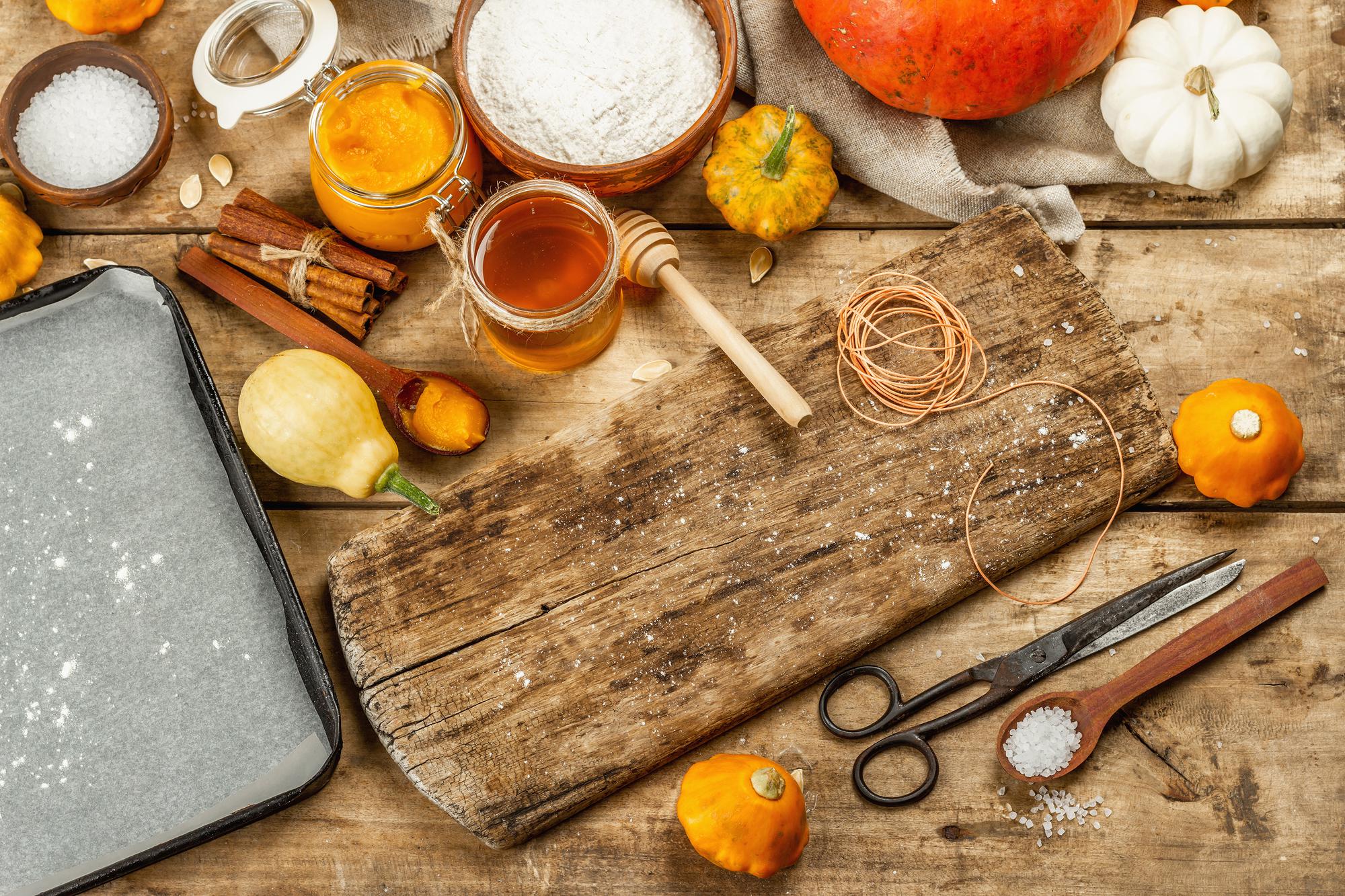 Rustic kitchen counter with ingredients and notebooks